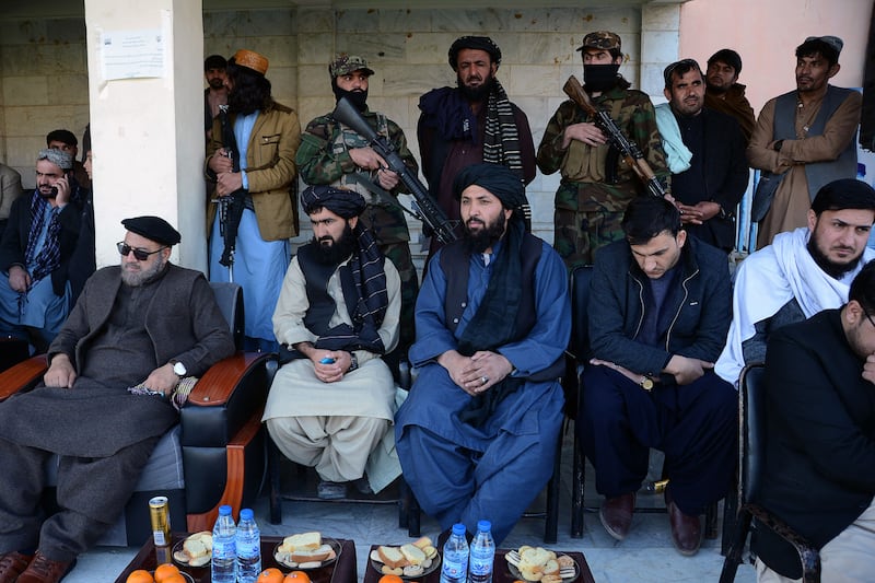Members of the Taliban watch a football match at the stadium in Kandahar. AFP