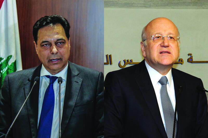 Lebanese PM Hassan Diab and previous Lebanese PM Najib Mikati. AFP/ EPA