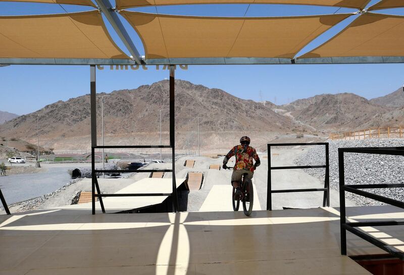 FUJAIRAH, UNITED ARAB EMIRATES , March 23, 2021 –   Tyler Bruce, enjoying riding a bicycle at the Fujairah Adventures Park in Fujairah. (Pawan Singh / The National) For Instagram/Online/ Lifestyle. Story by Janice Rodrigues