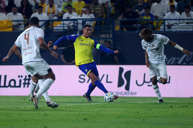 Al Nassr forward Cristiano Ronaldo runs at the Al Shabab defence. AFP