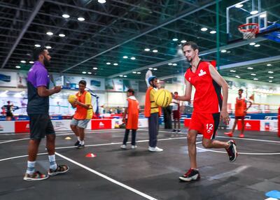 Dubai, U.A.E., June 25, 2018.  Special Olympics is launching a summer camp at Dubai Sports World for young people with intellectual disabilities at Hall 2, World Trade Centre.  Khalid Al Manie dribbles the ball during the practice session.
Victor Besa / The National
Section:  NA
Reporter:  Ramola Talwar