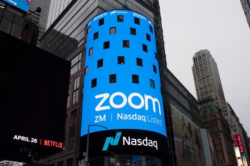 FILE - This April 18, 2019, file photo shows a sign for Zoom Video Communications ahead of the company's Nasdaq IPO in New York. Zoomâ€™s astronomical growth is tapering off along with the pandemic. That's raising questions about whether the videoconferencing serviceâ€™s immense popularity will fade as more people return to classrooms, offices and other places off limits for the past year. The deceleration emerged in an otherwise impressive quarterly earnings report released Monday, March 1, 2021. (AP Photo/Mark Lennihan, File)