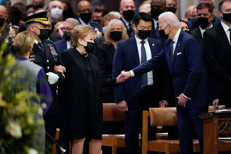 US President Joe Biden greets Elizabeth Dole as she arrives at the funeral for her husband at the Washington National Cathedral. AP