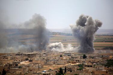 Plumes of smoke rise following Syrian government forces' bombardment on the town of Khan Sheikhoun in Idlib province on June 6, 2019. AFP