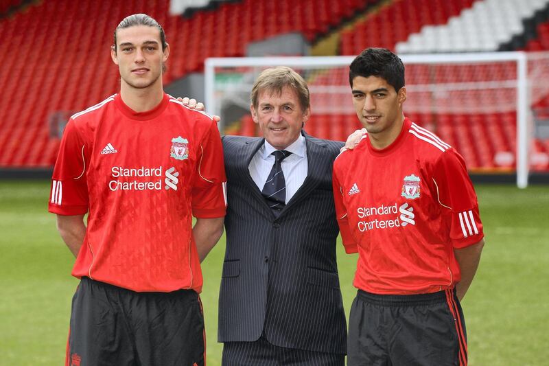 LIVERPOOL, ENGLAND - FEBRUARY 03:  Kenny Dalglish the manager of Liverpool stands between his new signings, Andy Carroll (l) and Luis Suarez (r) during a photocall at Anfield on February 3, 2011 in Liverpool, England.  (Photo by Alex Livesey/Getty Images)