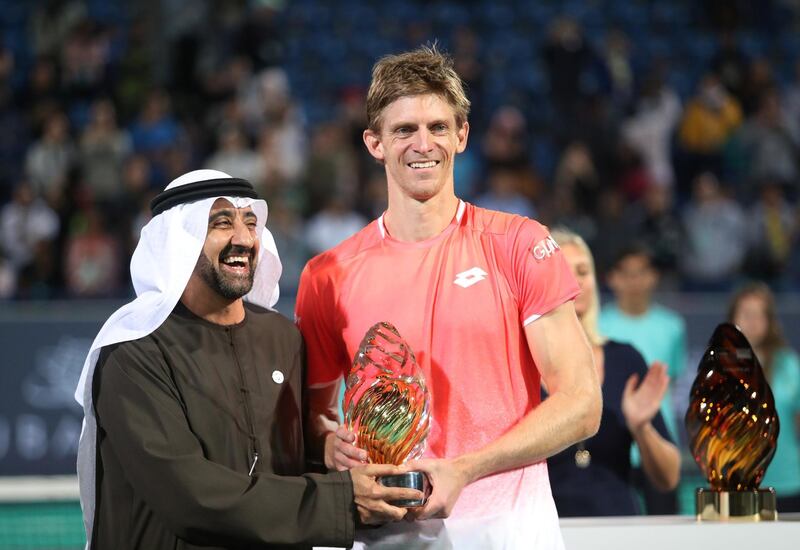 Kevin Anderson, who won the title last year, is presented with the runner-up trophy. But he has once again won the hearts of tennis fans in the capital. Suhaib Salem / Reuters