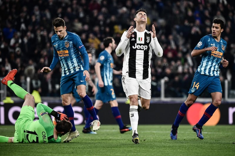 Juventus' Portuguese forward Cristiano Ronaldo, centre, reacts after missing a goal opportunity. AFP