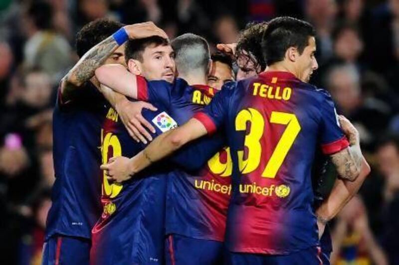BARCELONA, SPAIN - MARCH 09: Lionel Messi of FC Barcelona (L) celebrates with his teammates after scoring his team's second goal during the La Liga match between FC Barcelona and RC Deportivo La Coruna at Camp Nou on March 9, 2013 in Barcelona, Spain. (Photo by David Ramos/Getty Images) *** Local Caption *** 163417833.jpg