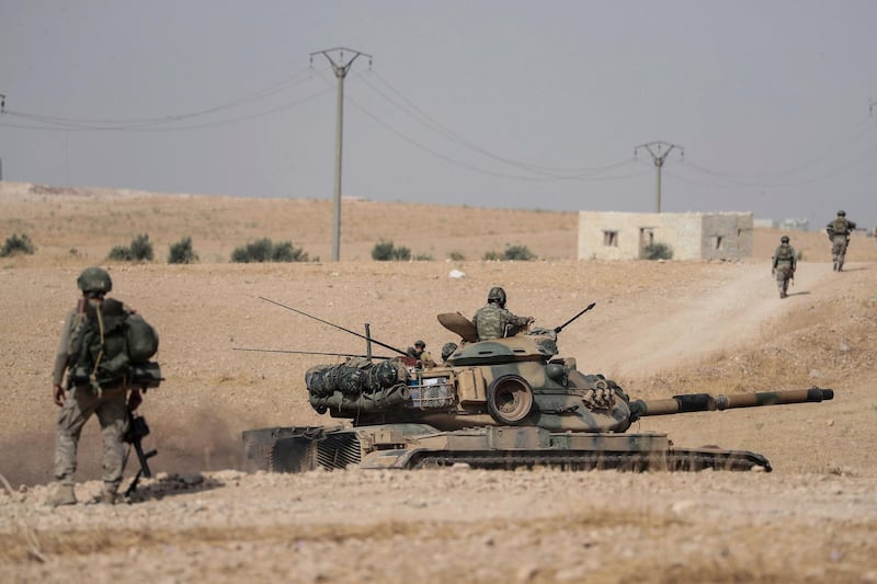 Turkish tanks and troops stationed near Syrian town of Manbij. AP