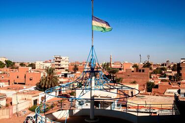 Sudan's independence-era flag, a symbol for the 2019 revolution which toppled former leader Omar Al Bashir, flying in the city of Omdurman. AFP