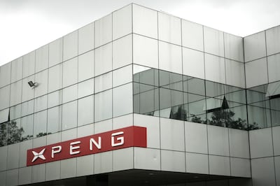 Logo is displayed at the Xpeng Motors Technology Ltd. prototype center in Guangzhou, China, on Wednesday, June 6, 2018. Though Xpeng hasn't delivered a single vehicle, doesn't own a factory and hasn't obtained a production license from the government, the Chinese electric automaker expects to raise more than $600 million this month from investors that include Alibaba, valuing it close to $4 billion, according to a person familiar with the fundraising. Photographer: Giulia Marchi/Bloomberg