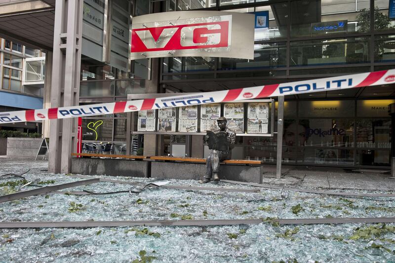 A picture shows the damages at the entrance of Norwegian newspaper VG building in Oslo on July 23, 2011 next to the government headquarters building area, a day after twin attacks here and on a youth camp, Norway's deadliest post-war tragedy. At least 91 people died in a shooting at a summer school meeting organised by the ruling Labour Party on Utoeya, an island outside the capital, while seven were killed when a powerful bomb ripped through central Oslo, where the prime minister's office and several government buildings are located.          AFP PHOTO / SCANPIX / Aleksander ANDERSEN
NORWAY OUT
 *** Local Caption ***  476216-01-08.jpg