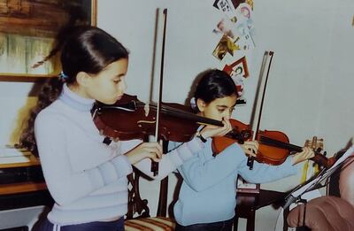 Once they started lessons, Sarah and Laura, above aged nine and six in their house in Glasgow, took to learning music quickly, as if it were a puzzle. Photo: The Ayoub Sisters