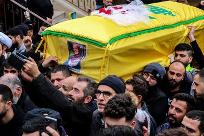 Mourners carry the coffin of a woman who was killed together with a Hezbollah fighter in Israeli bombardment in southern Lebanon, during a funeral procession in Bint Jbeil, near the border with Israel. AFP