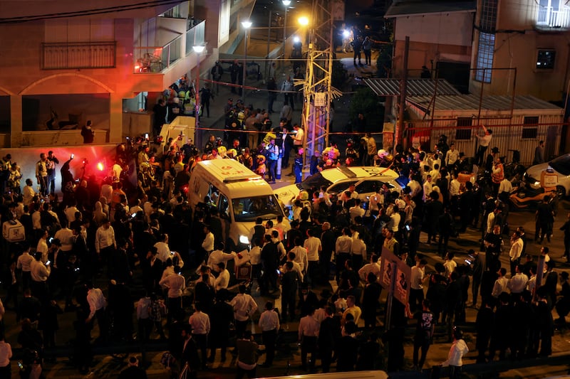 Crowds gather at the scene after five people were killed by a gunman on a main street in Bnei Brak, near Tel Aviv, on Tuesday. Reuters