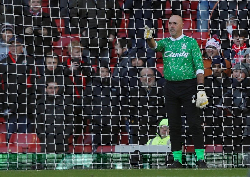 Former Liverpool goalkeeper Bruce Grobbelaar on the pitch during half time. Reuters