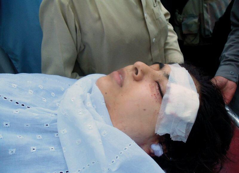 On October 9, 2012, Pakistani hospital workers carry injured Malala Yousafzai, then 14, on a stretcher after her assassination attempt by gunmen in Mingora. Mohammed Rehman / AFP Photo