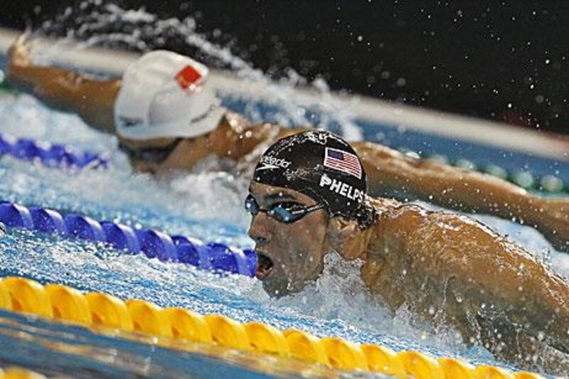 Michael Phelps, right, holds of the challenge from China's Wu Peng to take 200m butterfly gold at the world championships in Shanghai.