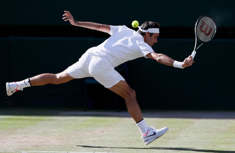 FILE - In this July 14, 2017, file photo, Switzerland's Roger Federer returns to Czech Republic's Tomas Berdych during their Men's Singles semifinal match at the Wimbledon Tennis Championships in London. Federer is expected to compete in the Wimbledon tennis tournament that begins Monday, July 2, 2018. (AP Photo/Kirsty Wigglesworth)