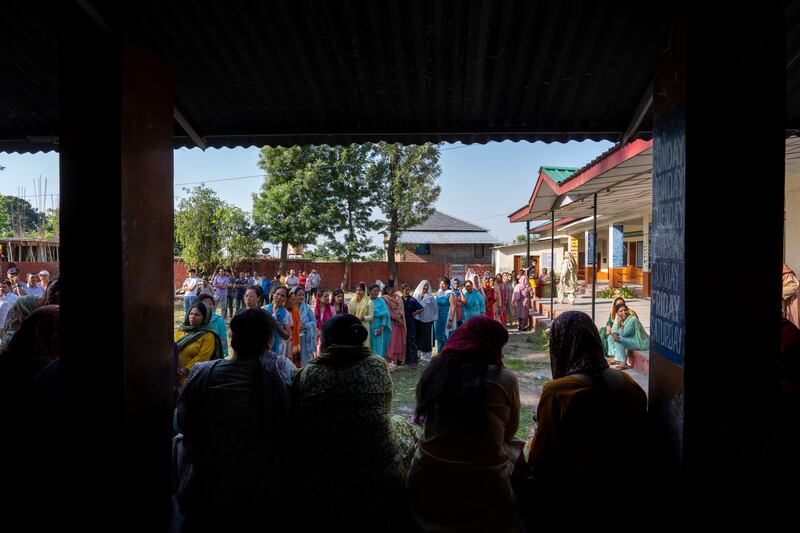 Women in Dharamshala, Himchal Pradesh, queue to cast their votes. AP Photo