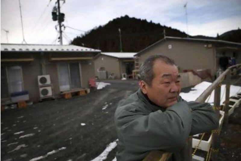 Yoshihiro Takahashi, 65, stands outside his temporary house in Onagawa in Miyagi prefecture. Takahashi lost his wife, Hisako, and mother Satoko as well as his house by the massive tsunami hit the northern Japan on March 11, 2011. Photos by Kuni Takahashi for The National