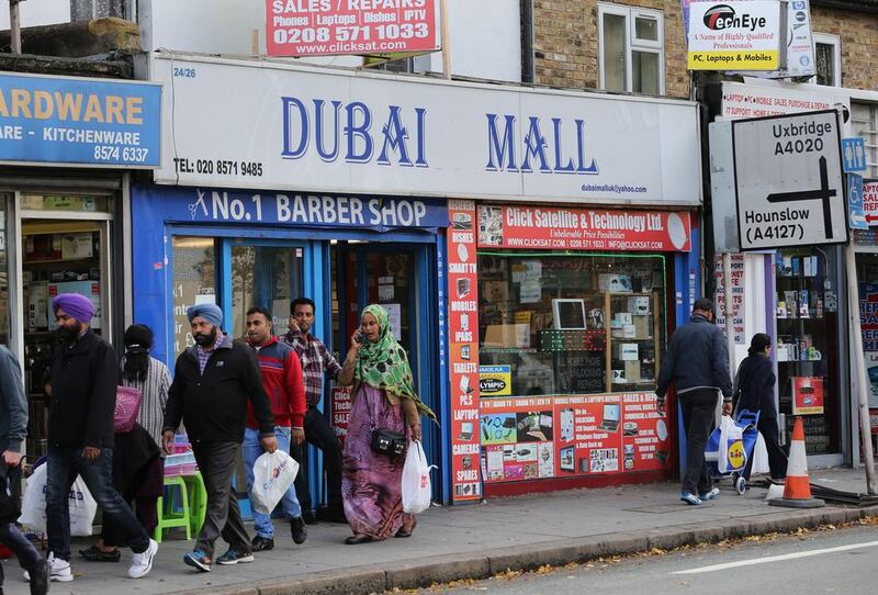 London's 'Dubai Mall' provokes laughter among any passers-by who have been to the real mall and shopkeepers say many tourists stop to take photos beneath the signage. Stephen Lock for The National 