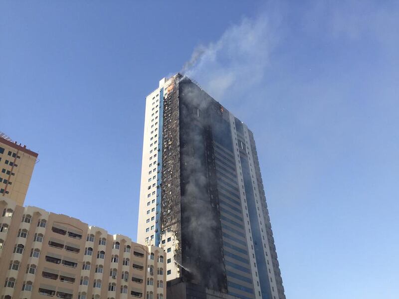 Residents were forced to flee their homes on Thursday after flames were seen spreading up outside their 32-floor tower block. Thaer Zriqat/The National