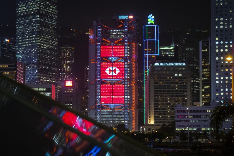 The HSBC Holdings Plc headquarters building stands illuminated in Hong Kong, China, on Monday, Sept. 21, 2020. HSBC slumped below its financial crisis low set more than a decade ago as pressures mount on several fronts including a potential threat to its expansion plans in China. Photographer: Chan Long Hei/Bloomberg