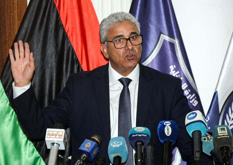 (FILES) A file photo taken on July 28, 2020 shows Fathi Bashagha, Interior Minister of Libya's UN-recognised Government of National Accord (GNA), addressing a press conference at the Tajura Training Institute, southeast of the GNA-held capital Tripoli. The powerful interior minister of Libya's unity government survived an assassination attempt on February 21, 2021 on a highway near the capital Tripoli, an official from his inner circle told AFP. / AFP / Mahmud TURKIA
