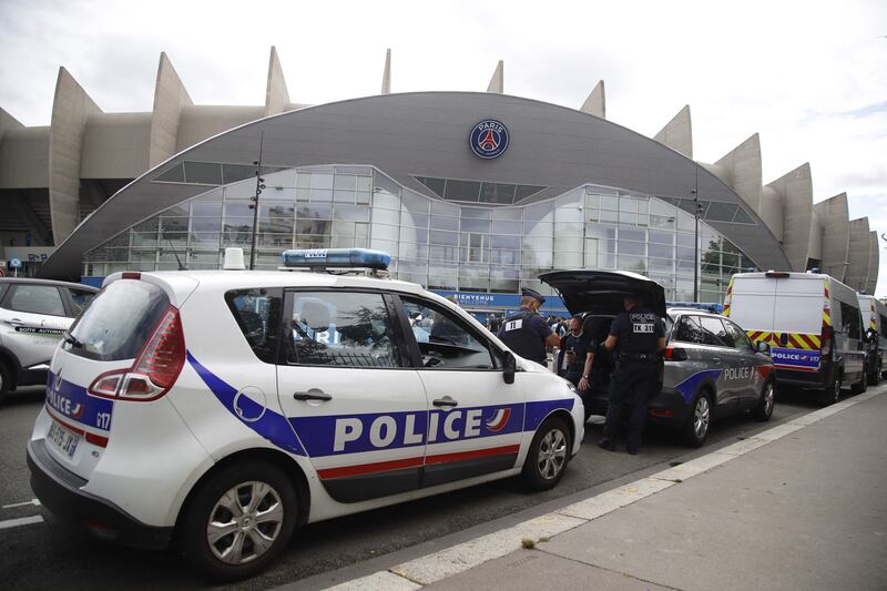 Police officers stand outside Paris Saint-Germain's Parc des Princes stadium in Paris, in anticipation of Lionel Messi's arrival.