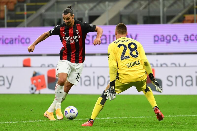 Zlatan Ibrahimovic takes on Bologna goalkeeper Lukasz Skorupski. AFP