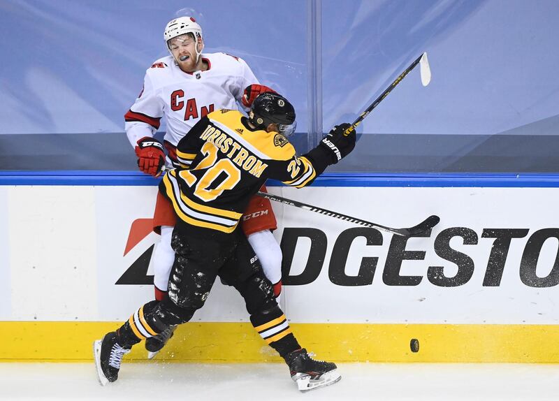 Boston Bruins center Joakim Nordstrom clatters into Carolina Hurricanes left wing Warren Foegele during the NHL hockey Eastern Conference Stanley Cup playoff game in Toronto, on Wednesday, August 12. AP