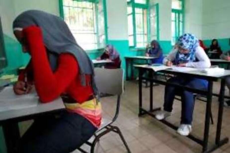 Palestinian students sit for their final high school exams, known as "Tawjihi", in the West Bank city of Ramallah on June 12, 2010. AFP PHOTO/ABBAS MOMANI