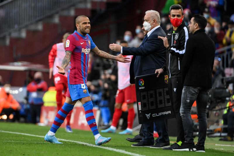 Barcelona's Dani Alves leaves the pitch after being sent-off. AFP