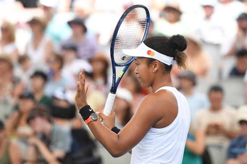 Naomi Osaka gestures an apology during Day Two of the Brisbane International. EPA