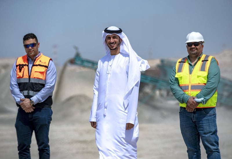 Abu Dhabi, United Arab Emirates, March 10, 2021.  A tour of the Ghayathi waste crusher facility in Al Dhafra region.  (L-R). Mohannad Raouf, Plant Manager, Al Dhafra Recycling Indstries; Khalid Al Khanbashi, Tadweer Ghayathi; Ahmed Nour Gamil, Operations director, EIS.
Victor Besa/The National
Section:  NA
Reporter:  Haneen Dajani