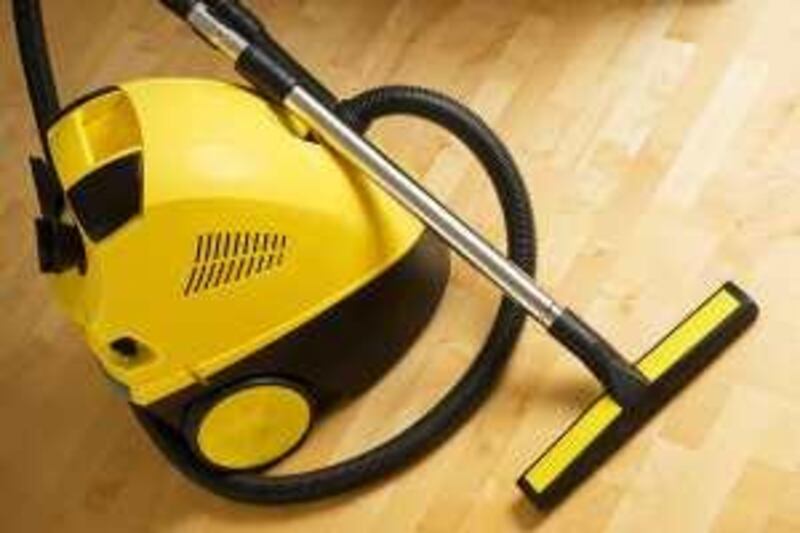 vacuum cleaner on a wooden floor (iStockphoto.com)
