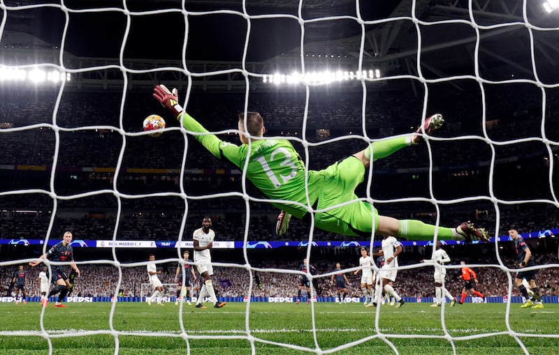 Josko Gvardiol's shot flies past Real Madrid goalkeeper Andriy Lunin for Manchester City's third goal. Reuters