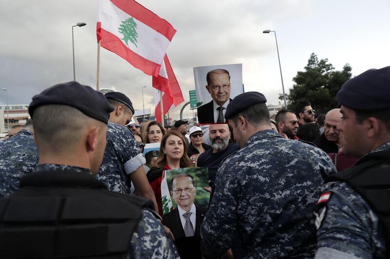 Backers of the Free Patriotic Movement founded by Lebanese President Michel Aoun (pictures) stage a rally in his support on a road leading to the presidential palace in Baabda near the capital Beirut. AFP