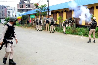 Security personnel fire tear gas during a protest in Imphal by Manipur's Meitei community on May 4.  AFP
