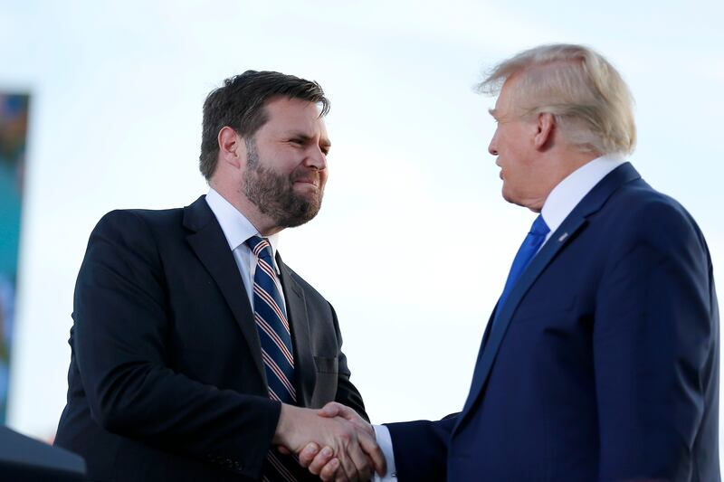 Senate candidate JD Vance greets former president Donald Trump at a rally in Delaware, Ohio. AP