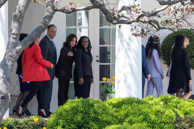 Judge Ketanji Brown Jackson smiles next to Vice President Kamala Harris after an event celebrating her confirmation to the US Supreme Court on the South Lawn of the White House on April 8, 2022, in Washington.  AFP