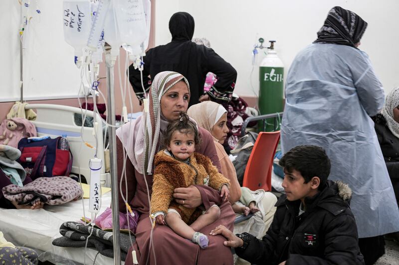 Palestinian women and children displaced from northern Gaza receive medical care at a clinic in Rafah. AFP