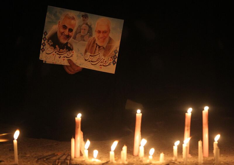 Supporters of the Popular Mobilisation Forces hold a candlelight vigil at the site of the January 3, 2019 US drone strike on Qassem Suleimani. AFP