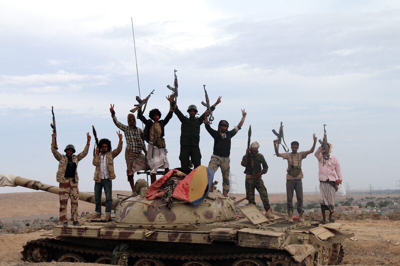 Militias loyal to Yemeni president Abdo Rabbo Mansour Hadi stand on a tank positioned in Lahj, Yemen. EPA