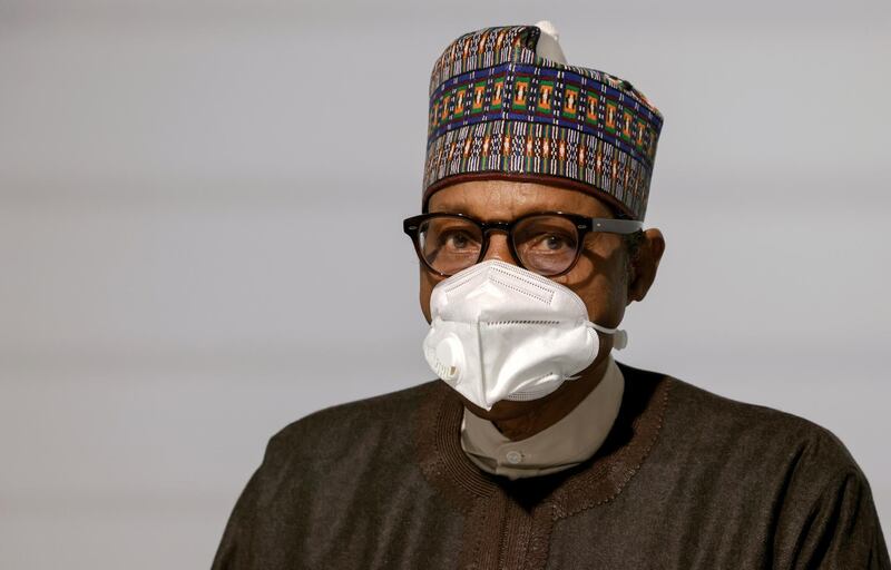 FILE PHOTO: Nigeria's President Muhammadu Buhari poses before the opening session of the Summit on the Financing of African Economies in Paris, France May 18, 2021. Ludovic Marin/Pool via REUTERS/File Photo