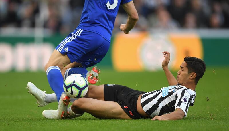 NEWCASTLE UPON TYNE, ENGLAND - SEPTEMBER 29:  Muto of Newcastle tackles Ben Chilwell of Leicester during the Premier League match between Newcastle United and Leicester City at St. James Park on September 29, 2018 in Newcastle upon Tyne, United Kingdom.  (Photo by Stu Forster/Getty Images)