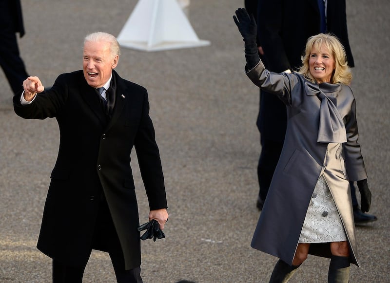 epa03548796 US Vice President Joe Biden (L) and his wife Dr Jill Biden (R) wave as they walk down Pennsylvania Avenue during the Inaugural parade after Biden was sworn in for a second term as the Vice President of the United States in Washington, DC, USA, 21 January 2013. Obama defeated Republican candidate Mitt Romney on Election Day 06 November 2012 to be re-elected for a second term.  EPA/TANNEN MAURY