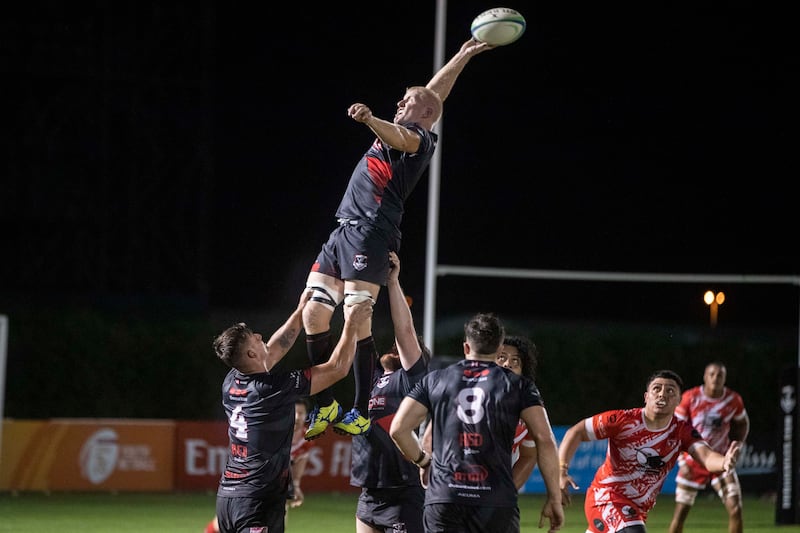  Dubai Exiles' Matthew Mills catches the ball during a line-out.