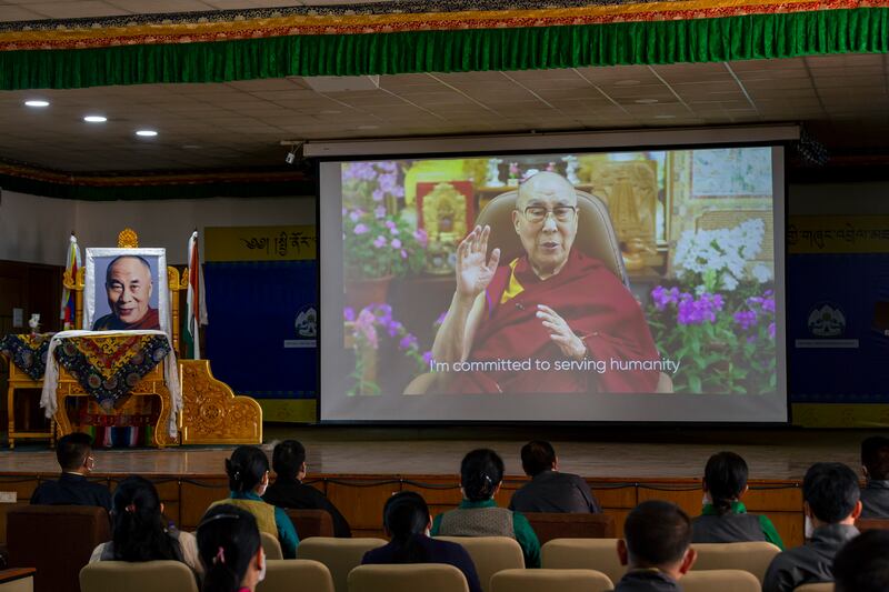 Exiled Tibetan government officials watch a message from their spiritual leader, the Dalai Lama, on his 86th birthday, in Dharamshala, India, on July 6.  AP